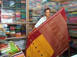 Elvis as sari shop owner 